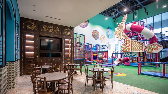 parents lounge area with iconic dragon slide